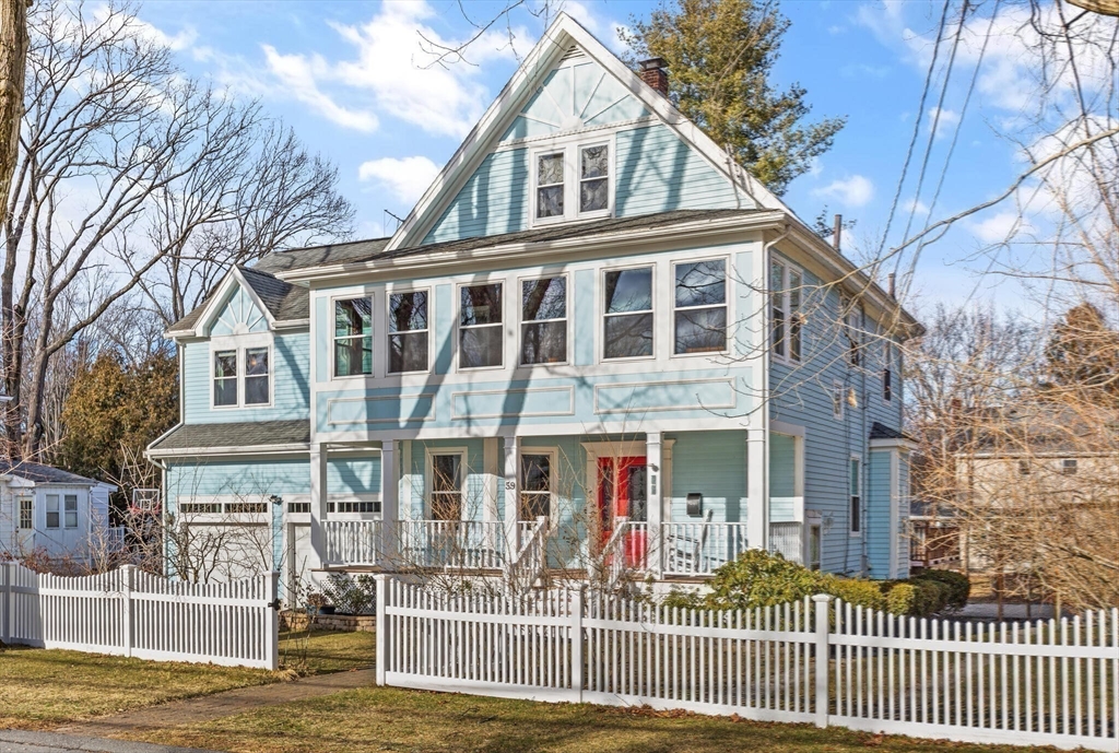 59 Reed Street Lexington, MA 02421 - Photo 1 of 32 a front view of a house with a iron gate