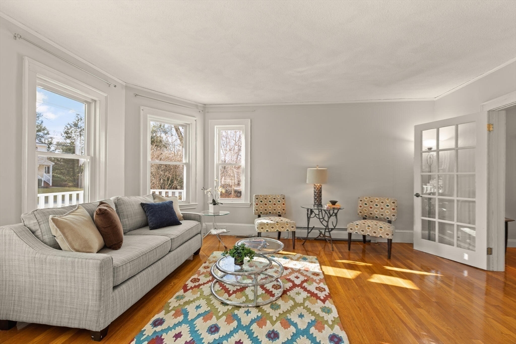 59 Reed Street Lexington, MA 02421 - Photo 12 of 32 a living room with furniture and a large window