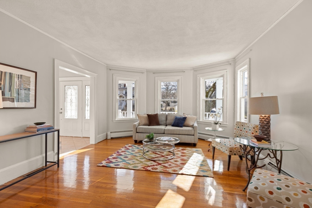 59 Reed Street Lexington, MA 02421 - Photo 13 of 32 a living room with furniture or couch and a window