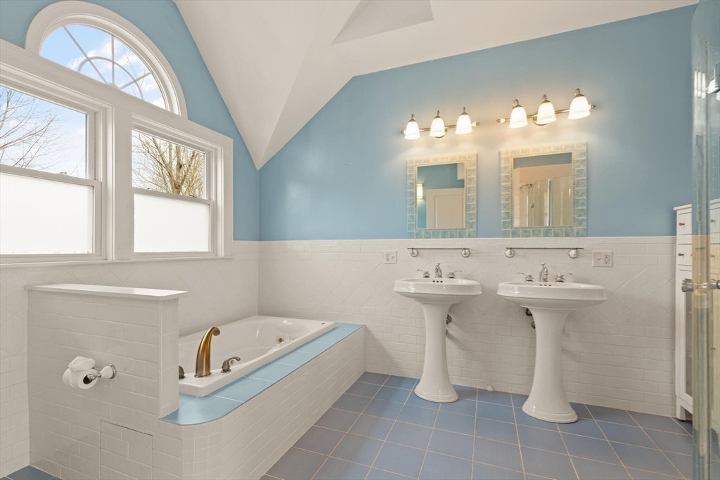 59 Reed Street Lexington, MA 02421 - Photo 18 of 32 a bathroom with a sink and a mirror