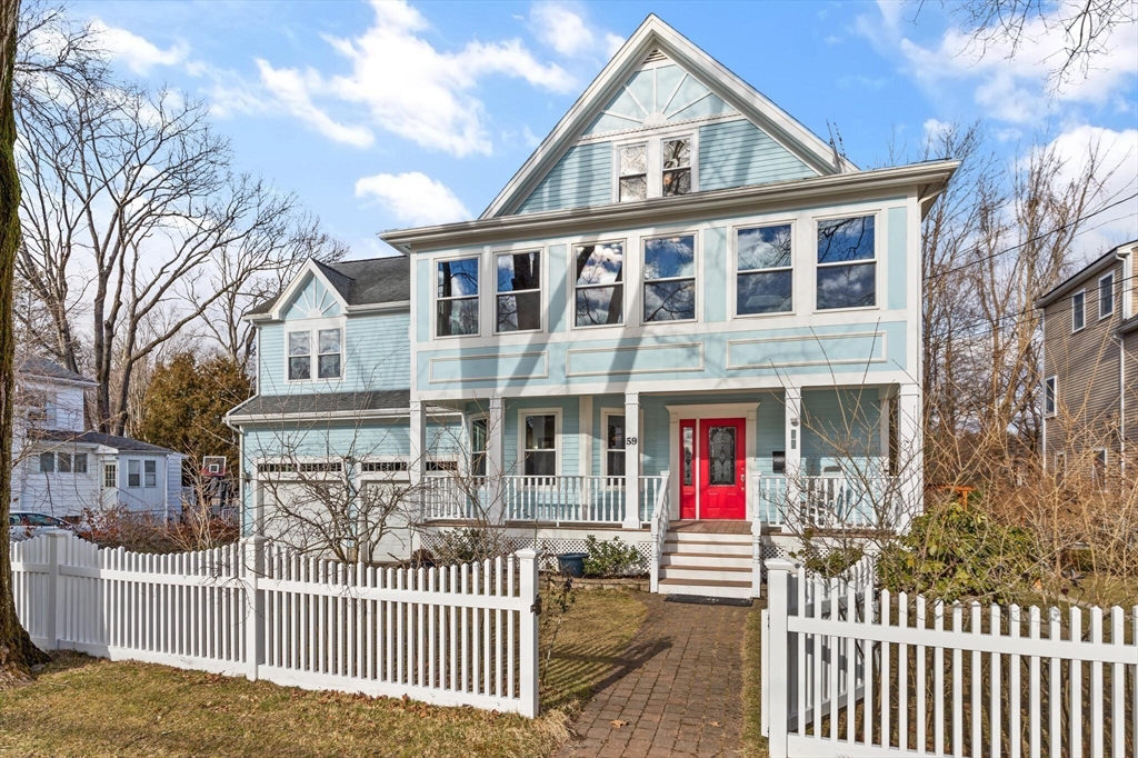 59 Reed Street Lexington, MA 02421 - Photo 32 of 32 a front view of a house with wooden fence