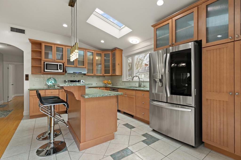 59 Reed Street Lexington, MA 02421 - Photo 5 of 32 a kitchen with stainless steel appliances granite countertop a refrigerator and a stove top oven