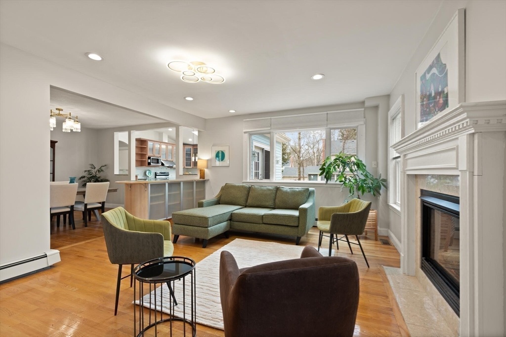 59 Reed Street Lexington, MA 02421 - Photo 8 of 32 a living room with furniture and a fireplace