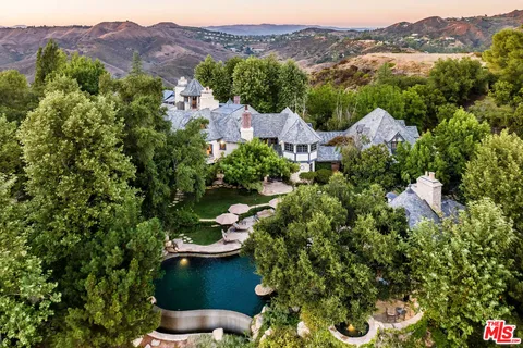 an aerial view of residential house and outdoor space