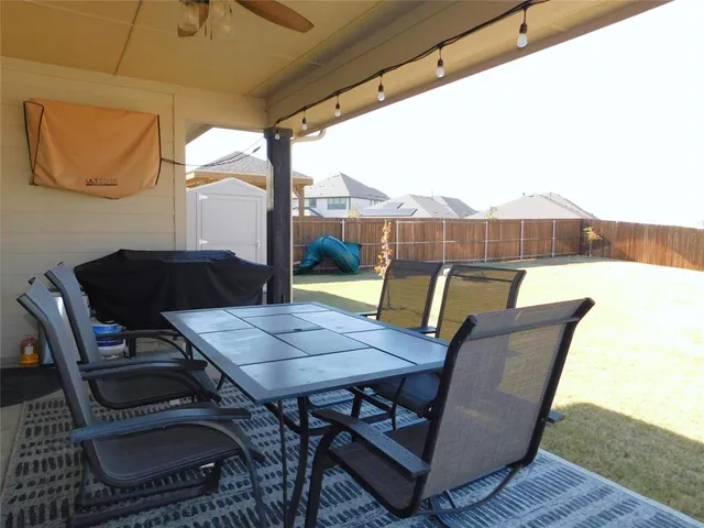 a view of backyard with seating space