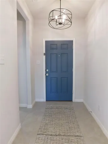 an empty room with wooden floor