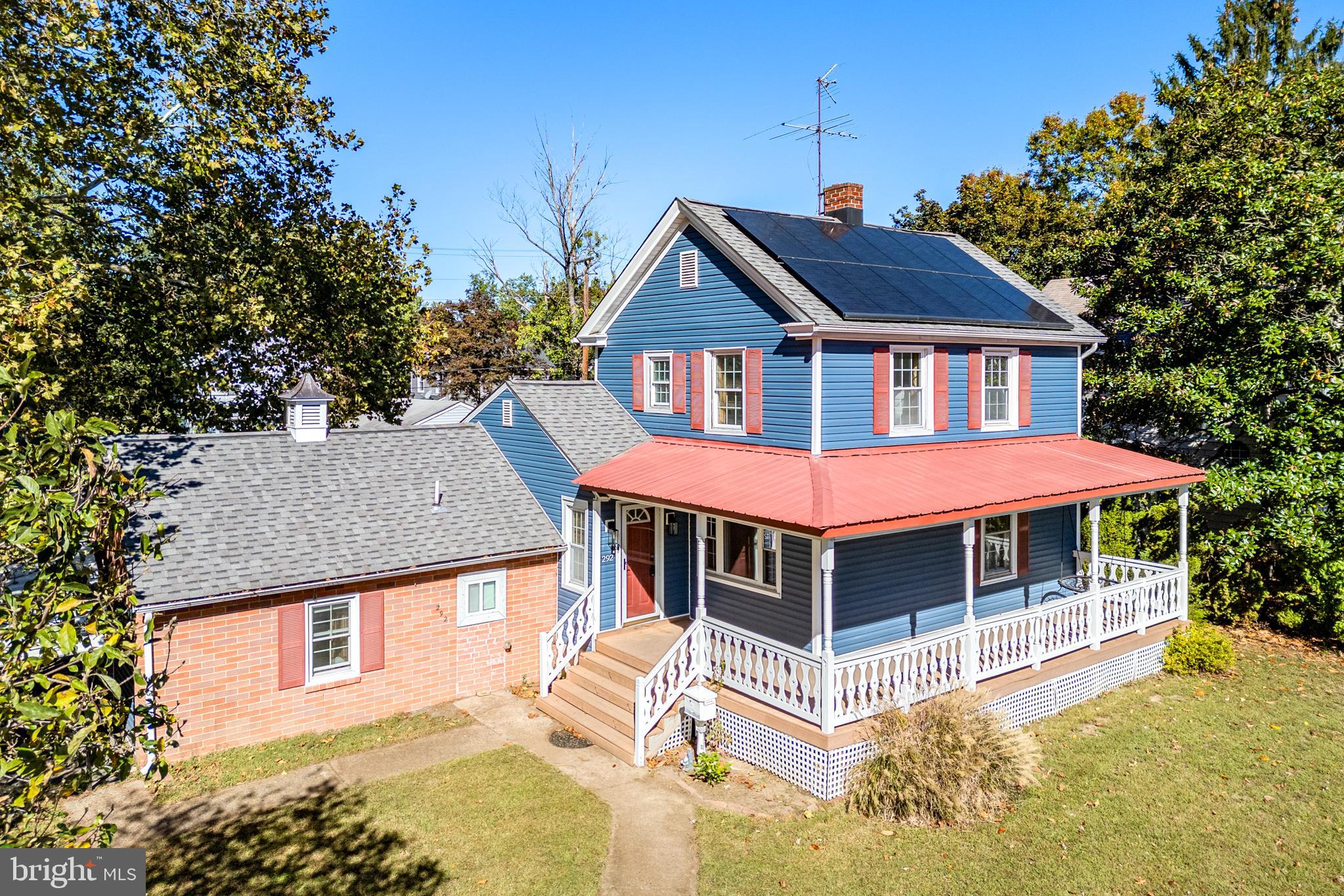 a view of a house with a yard balcony and furniture
