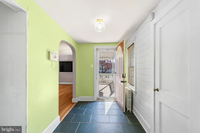 a view of a hallway with a livingroom and a hallway