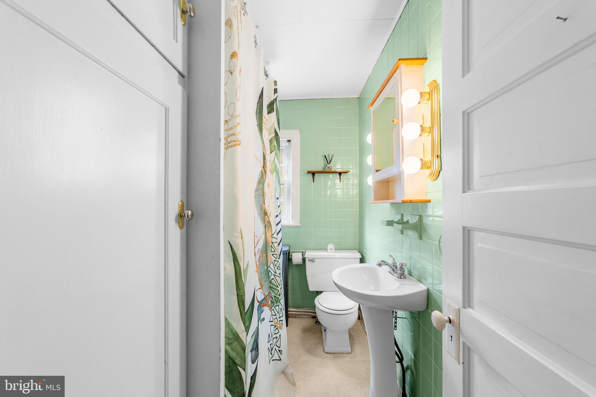 292 C Street Carneys Point, NJ 08069 - Photo 13 of 37 a bathroom with a toilet and a sink