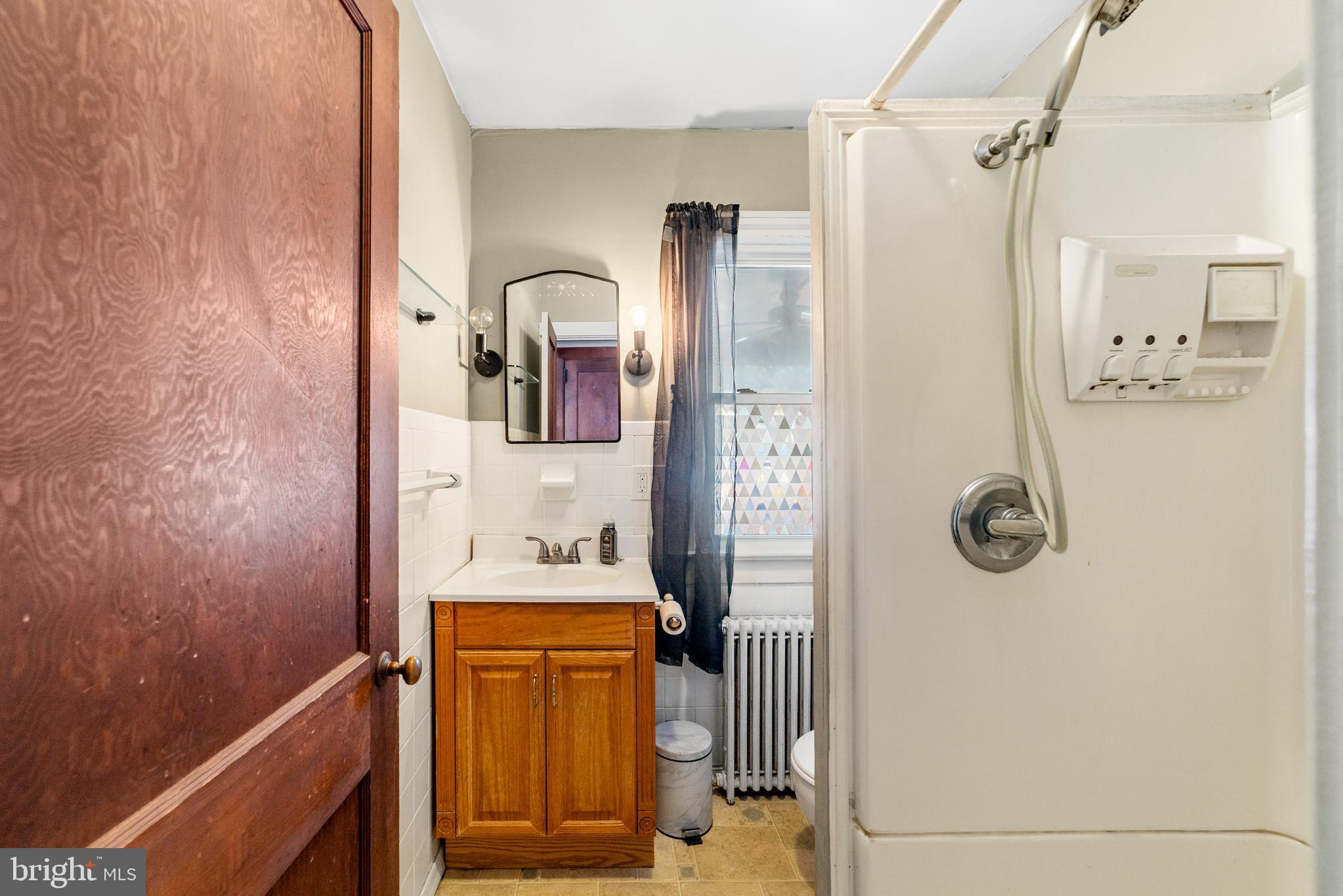 292 C Street Carneys Point, NJ 08069 - Photo 16 of 37 a bathroom with a sink a toilet and shower