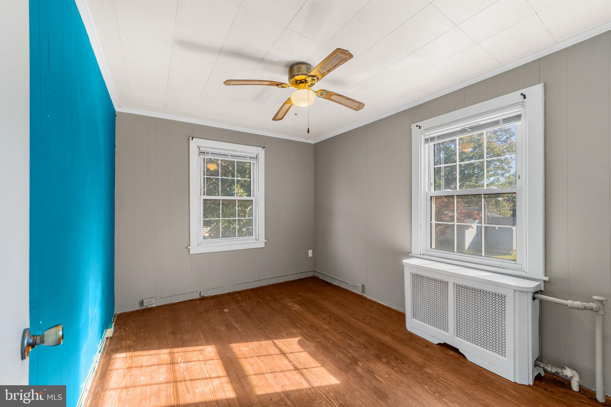 292 C Street Carneys Point, NJ 08069 - Photo 19 of 37 a view of an empty room with a window and wooden floor