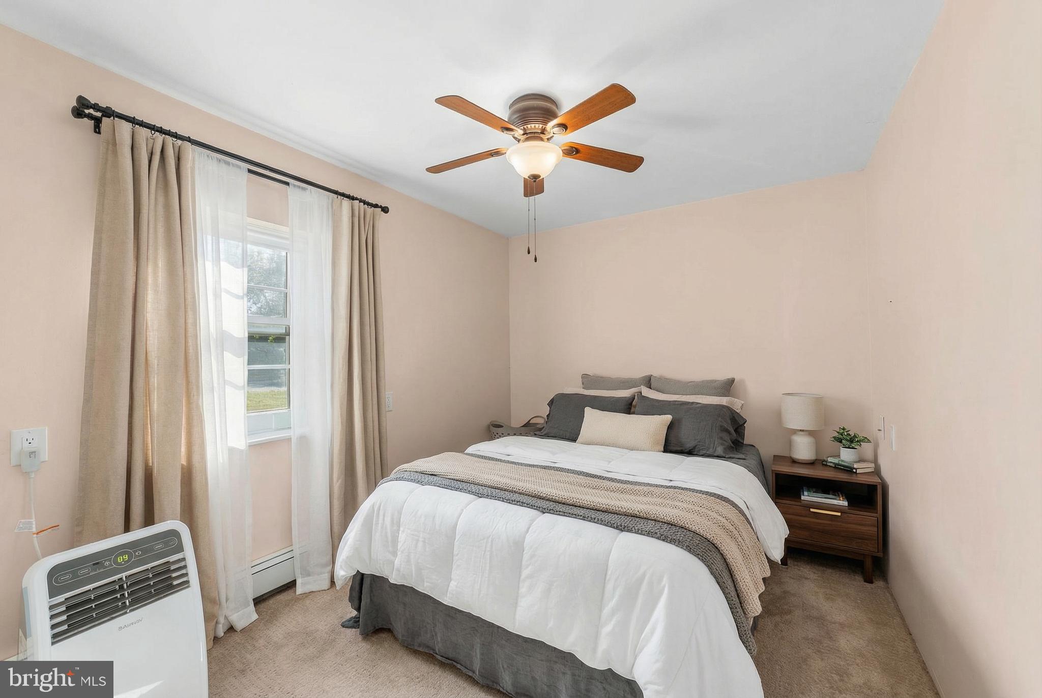 292 C Street Carneys Point, NJ 08069 - Photo 21 of 37 a bedroom with a bed and window