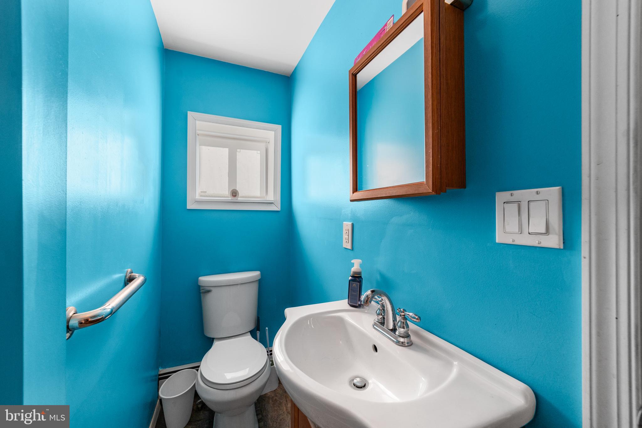 292 C Street Carneys Point, NJ 08069 - Photo 22 of 37 a bathroom with a toilet sink and mirror