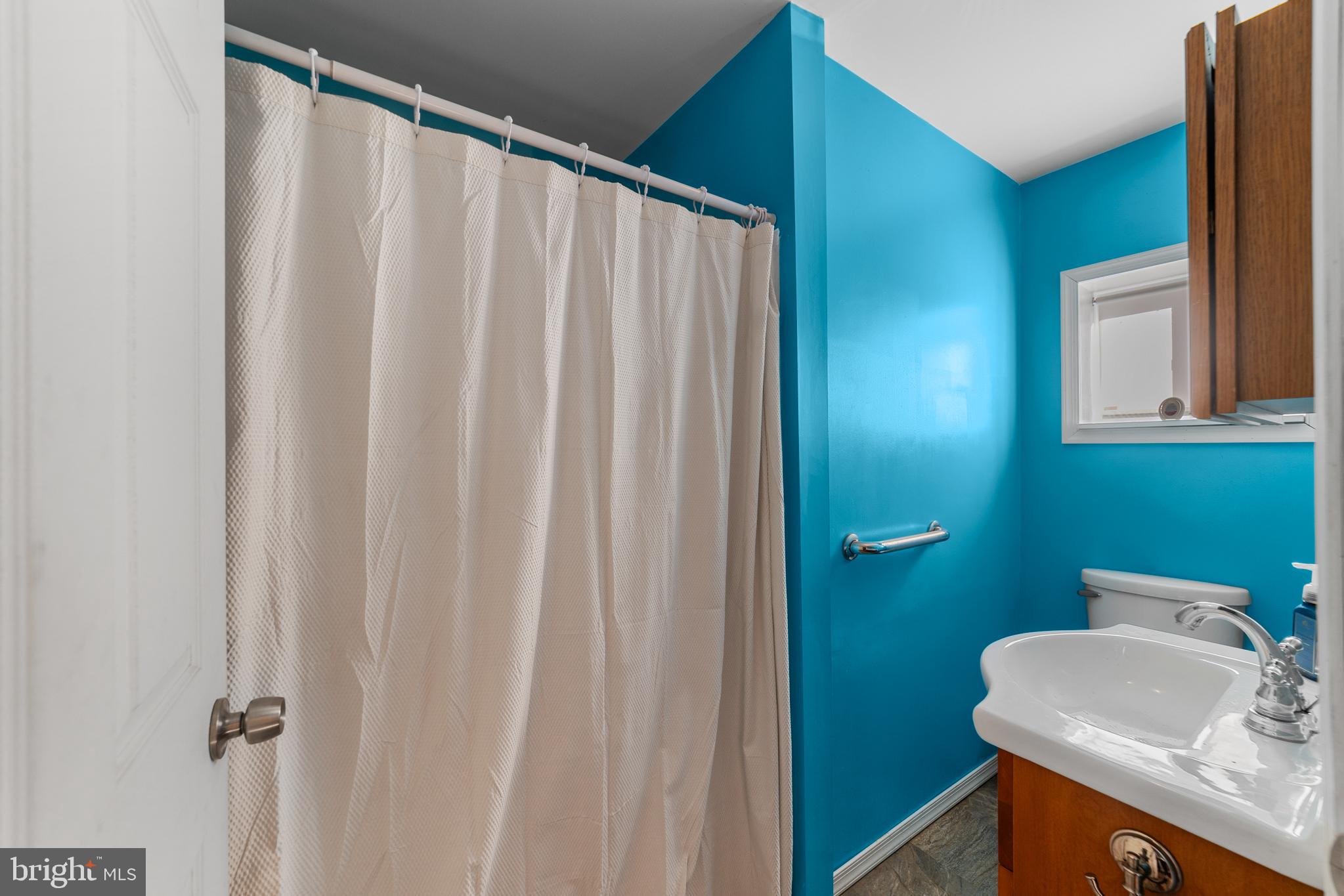 292 C Street Carneys Point, NJ 08069 - Photo 23 of 37 a bathroom with a sink and a mirror