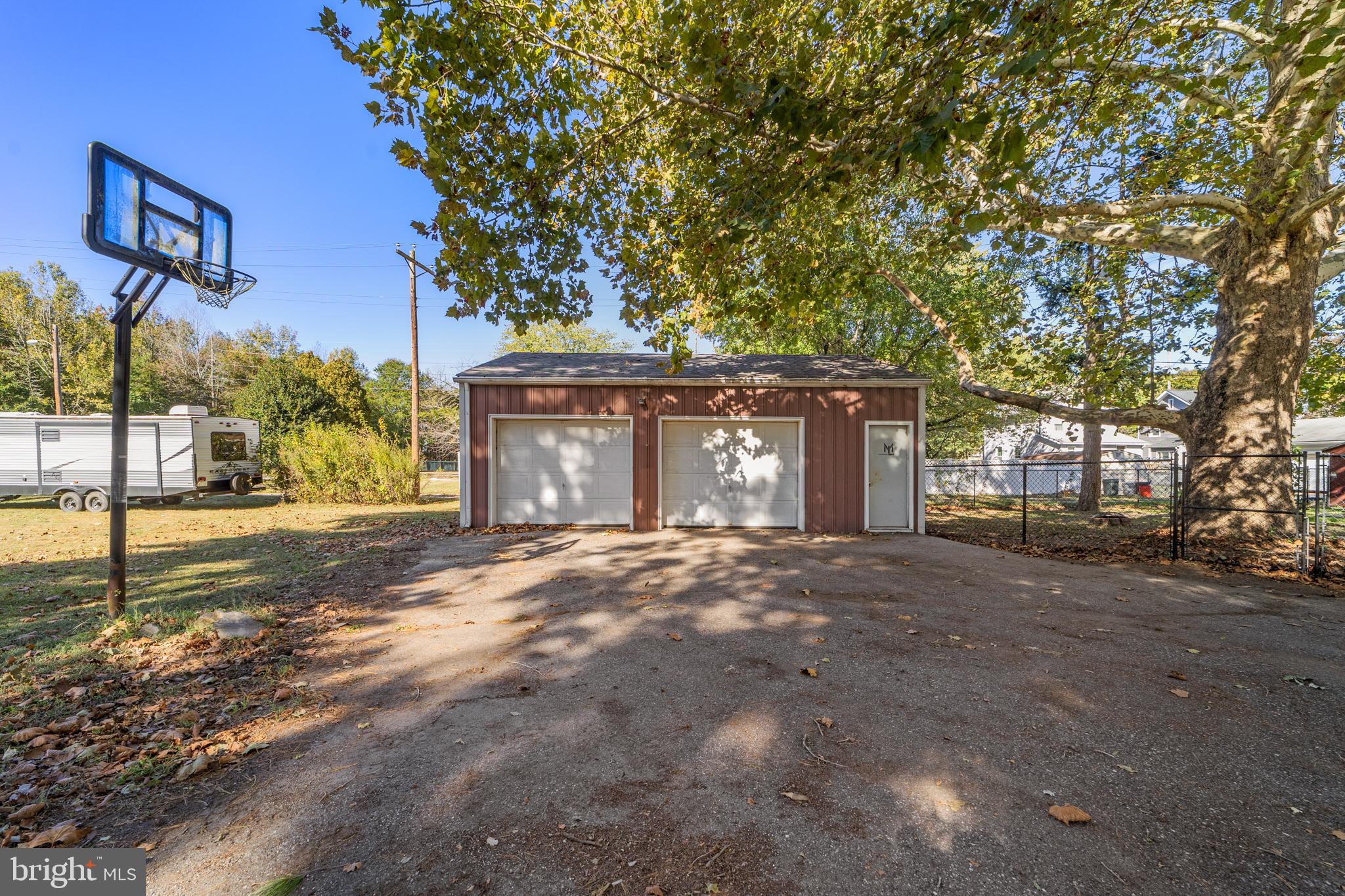 292 C Street Carneys Point, NJ 08069 - Photo 25 of 37 a view of a house with a yard and garage