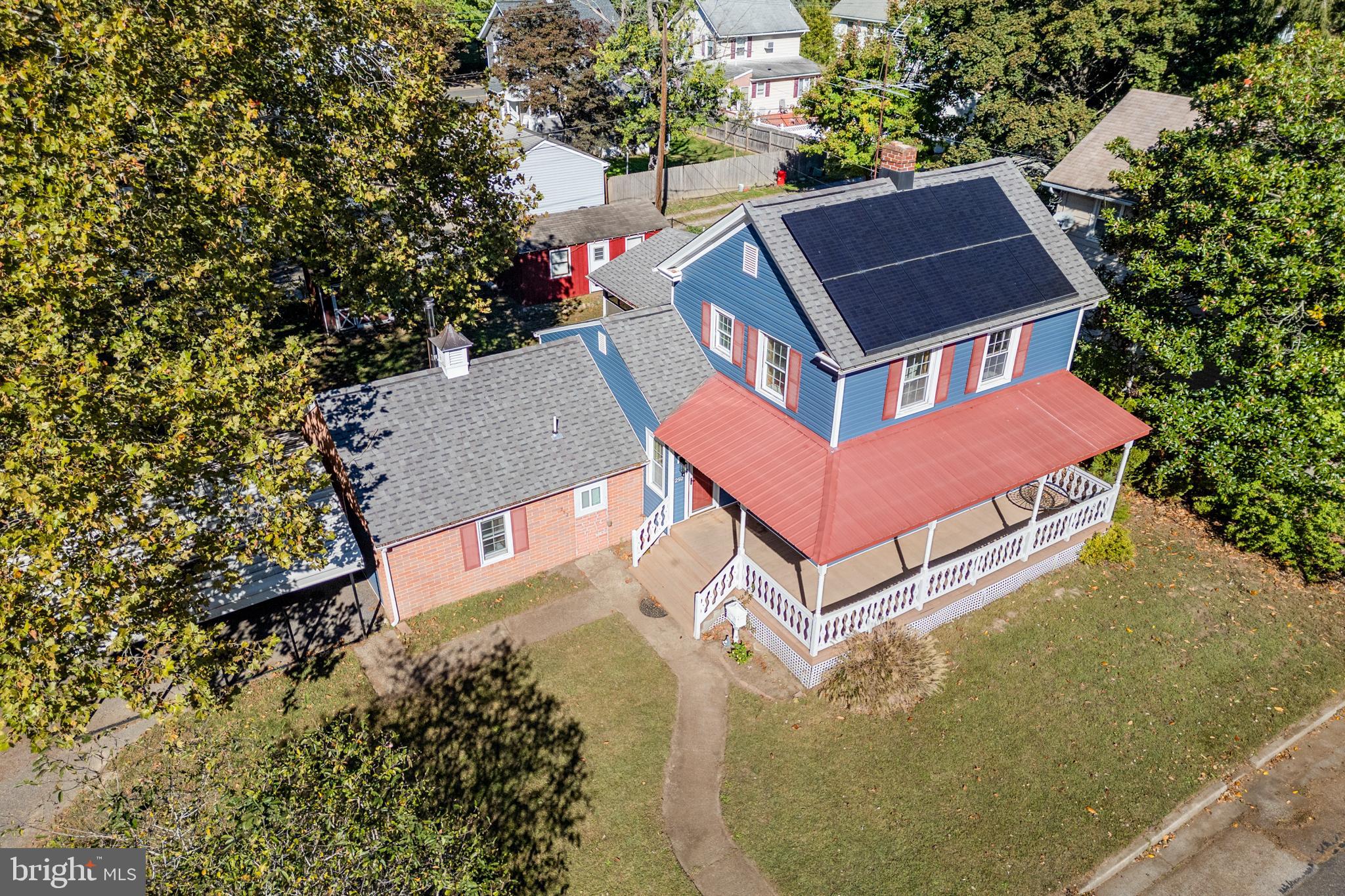 292 C Street Carneys Point, NJ 08069 - Photo 3 of 37 an aerial view of a house with a yard and trees