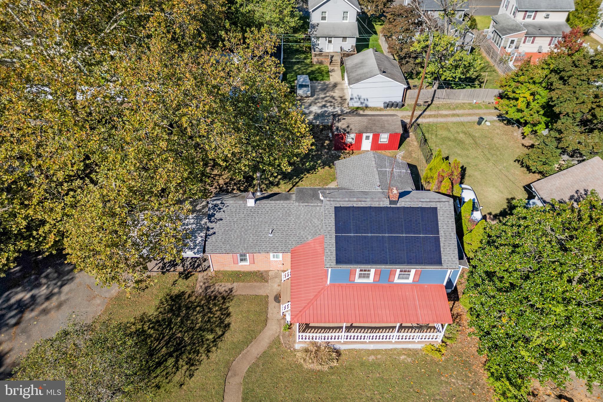 292 C Street Carneys Point, NJ 08069 - Photo 32 of 37 an aerial view of a house with a yard lake and trees all around