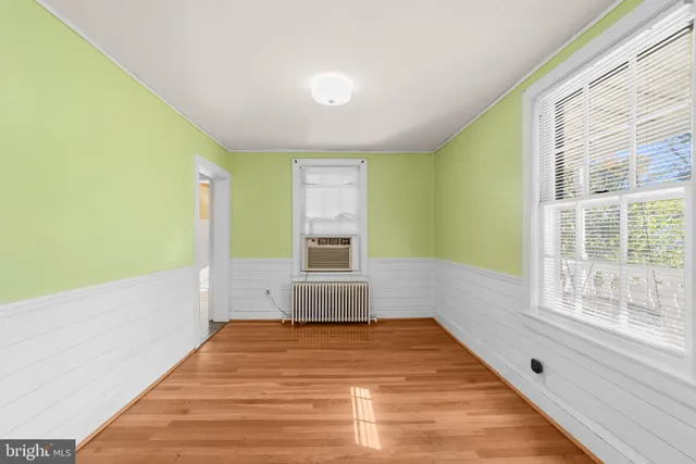 a bathroom with a bathtub and a window