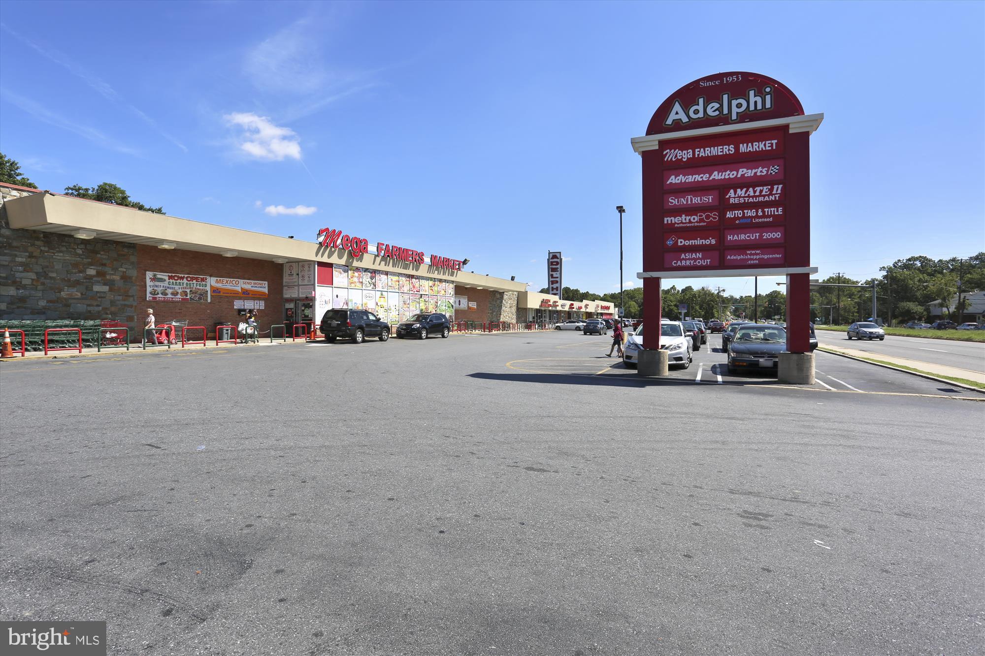 9274 Adelphi Road, Unit 202 Hyattsville, MD 20783 - Photo 18 of 25 a view of building with cars parked in front of it