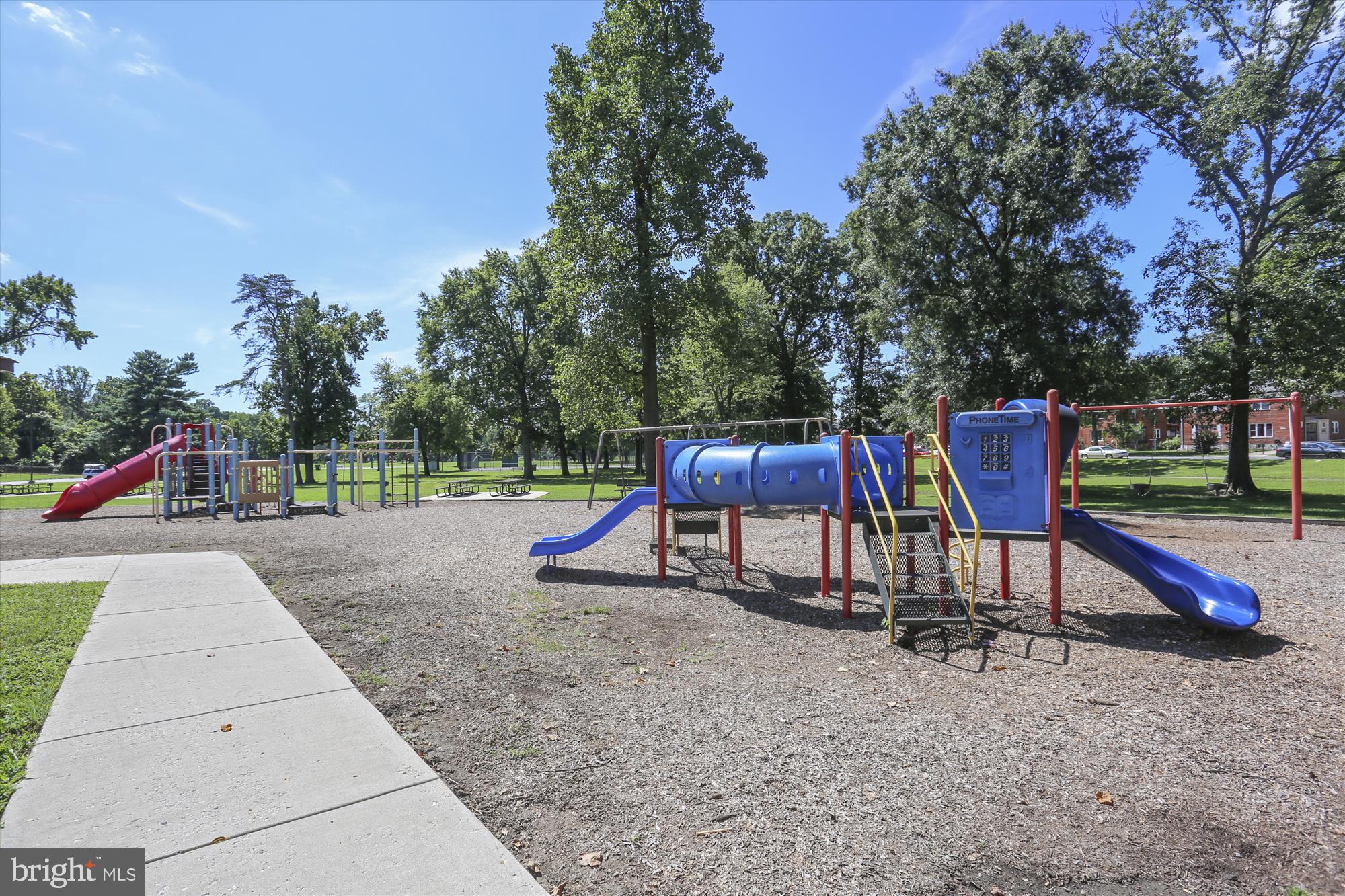 9274 Adelphi Road, Unit 202 Hyattsville, MD 20783 - Photo 21 of 25 a view of park with slide and trees