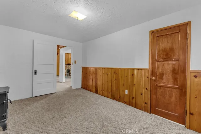 an empty room with closet area