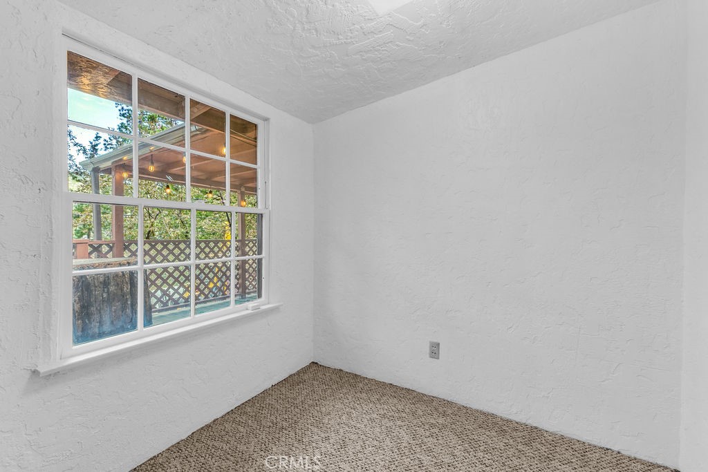 53705 Country Club Drive Idyllwild, CA 92549 - Photo 16 of 26 a view of an empty room with a window