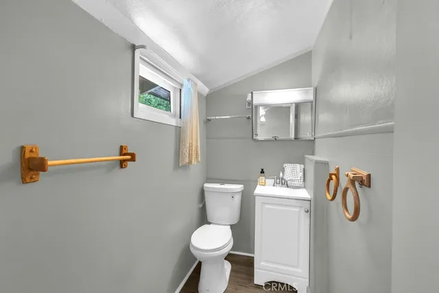 a white toilet sitting next to a bathroom sink