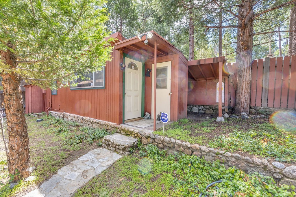 53705 Country Club Drive Idyllwild, CA 92549 - Photo 22 of 26 a front view of a house with garden