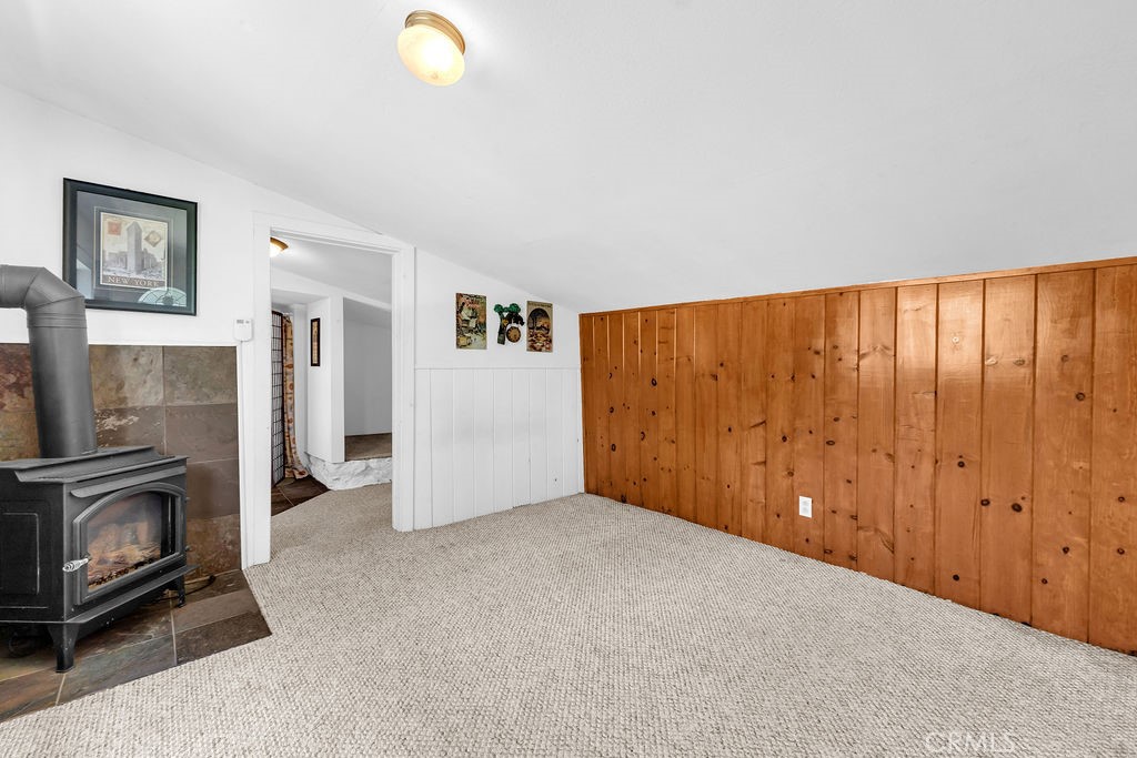 53705 Country Club Drive Idyllwild, CA 92549 - Photo 23 of 26 a view of an empty room with closet and a fireplace