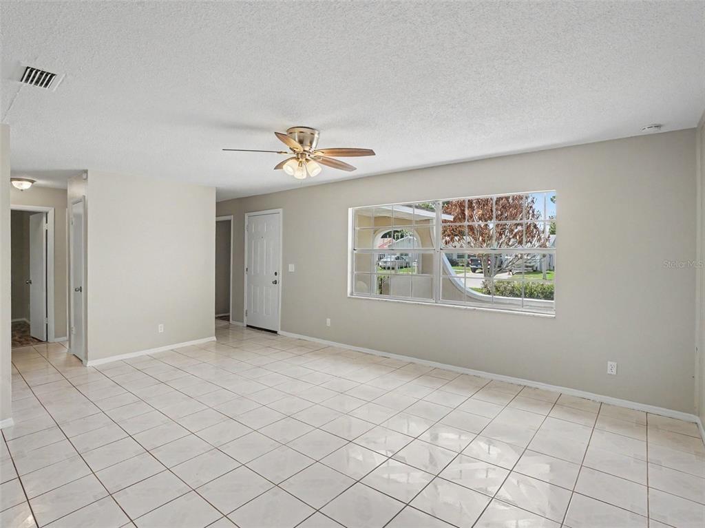 615 Thomas Jefferson Way Orlando, FL 32809 - Photo 3 of 17 a view of an empty room with a window