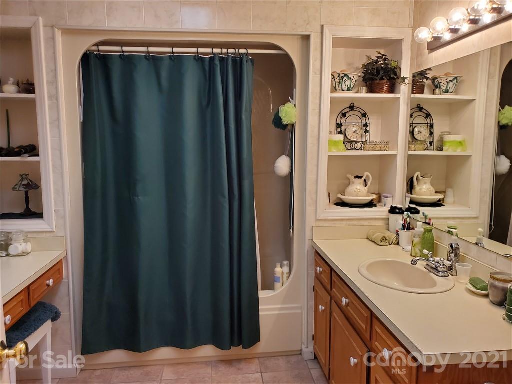 1856 Wesley Road Morganton, NC 28655 - Photo 4 of 7 a bathroom with a sink and a mirror