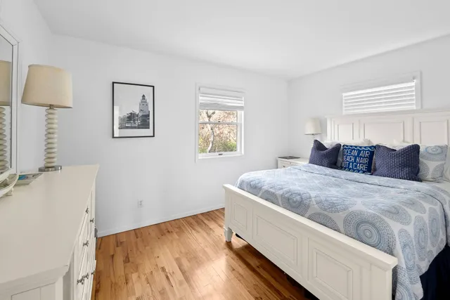 a room with a sink cabinets and a window