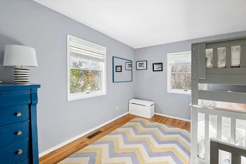 a bed room with a bed and a lamp