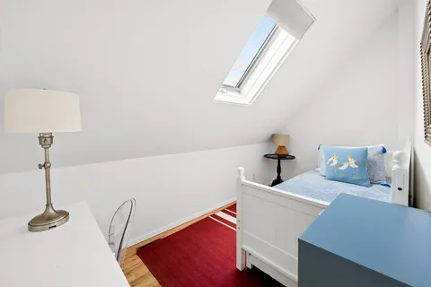 a room with a sink cabinets and a window