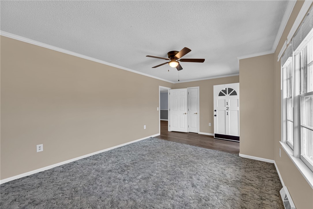 121 Wilson Road Anderson, SC 29625 - Photo 7 of 40 An inviting entryway transitions smoothly into this carpeted living space with ample natural light.