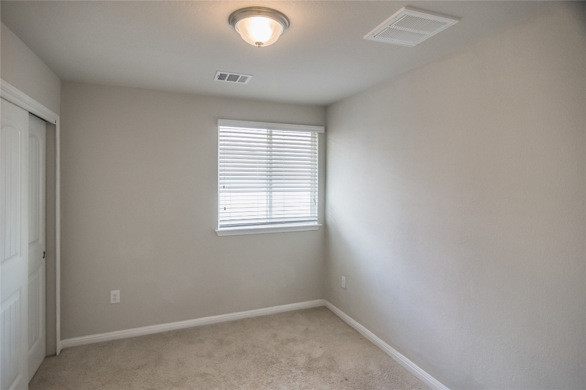 332 Cane River Road Pflugerville, TX 78660 - Photo 14 of 30 an empty room with a window