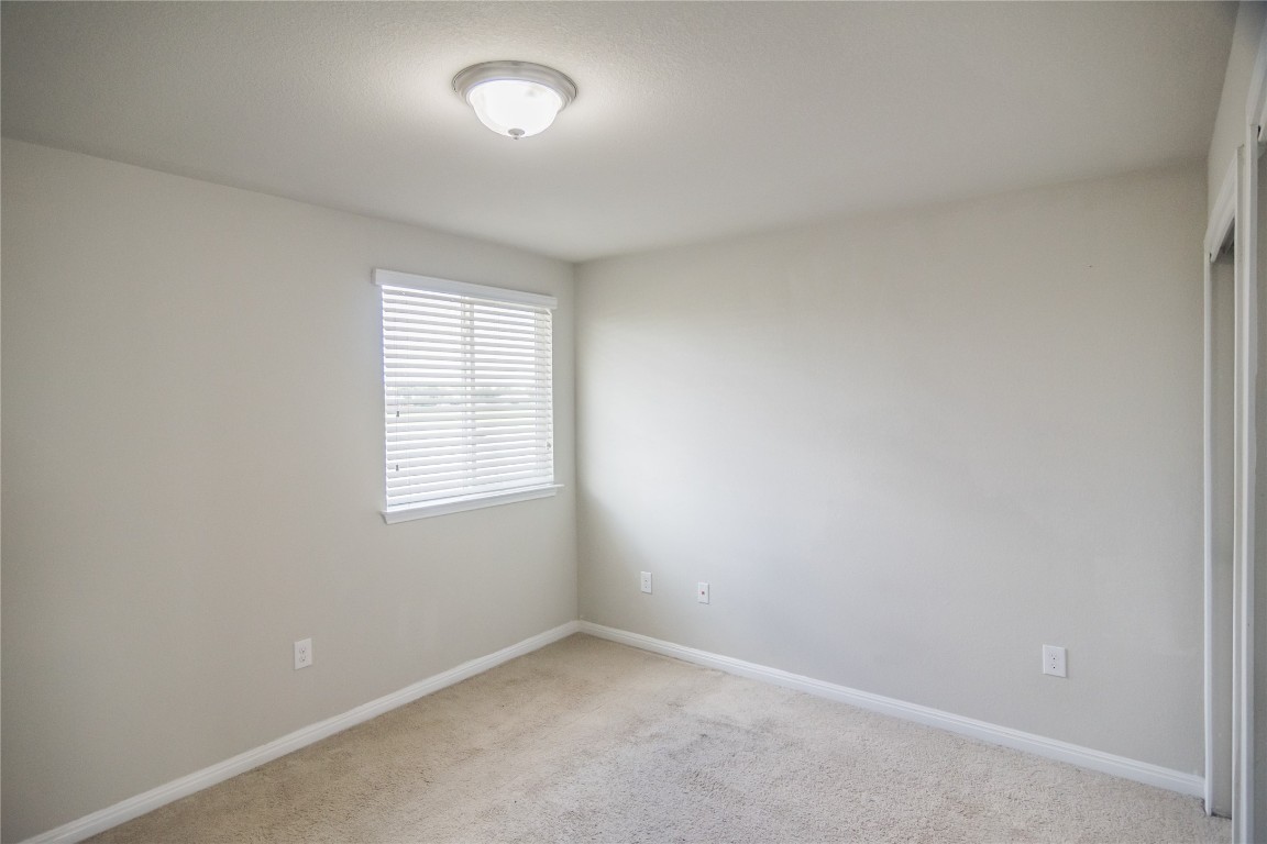 332 Cane River Road Pflugerville, TX 78660 - Photo 15 of 30 an empty room with a window