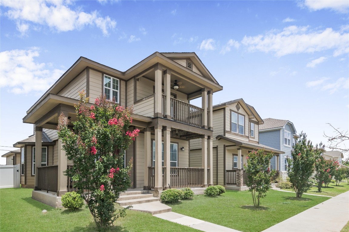 332 Cane River Road Pflugerville, TX 78660 - Photo 2 of 30 a front view of a house with a garden