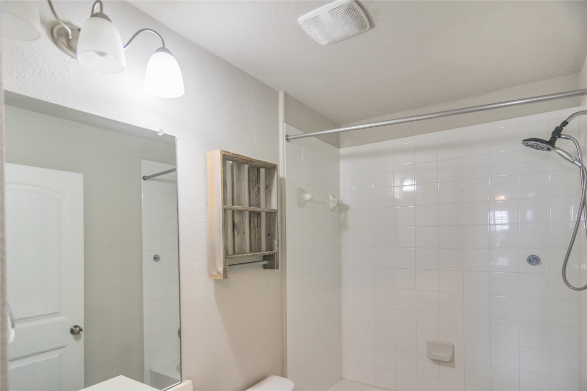 332 Cane River Road Pflugerville, TX 78660 - Photo 21 of 30 a bathroom with a shower