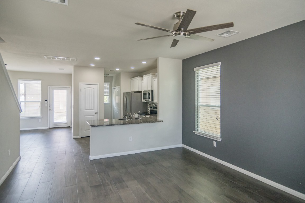 332 Cane River Road Pflugerville, TX 78660 - Photo 4 of 30 a view of a kitchen with a sink and a window