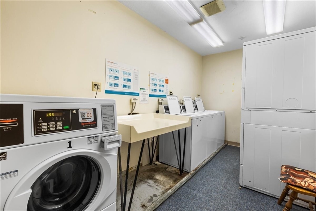 4925 Washington Street, Unit 304 Boston, MA 02132 - Photo 15 of 25 a utility room with dryer and washer
