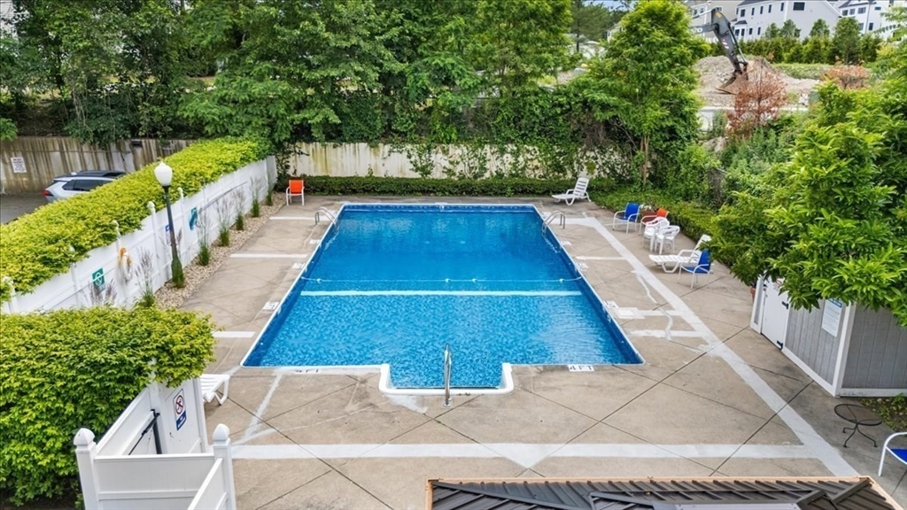 4925 Washington Street, Unit 304 Boston, MA 02132 - Photo 19 of 25 a view of balcony with wooden floor