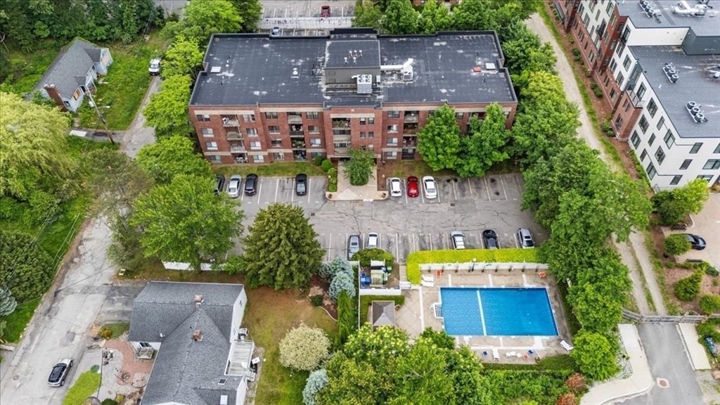 4925 Washington Street, Unit 304 Boston, MA 02132 - Photo 20 of 25 an aerial view of a house with a garden