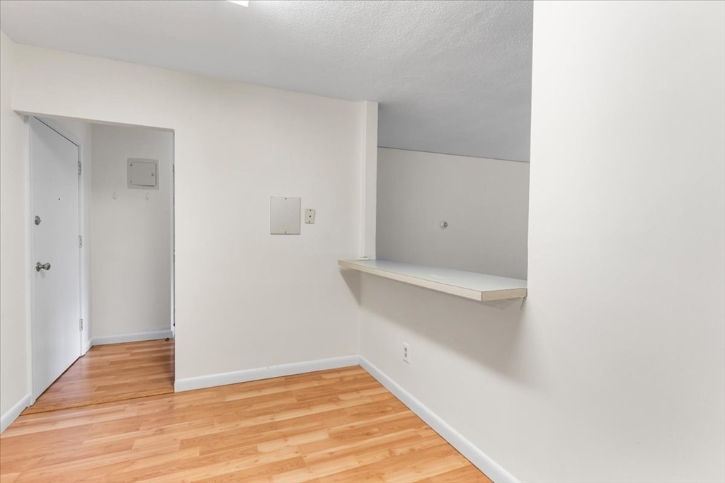 4925 Washington Street, Unit 304 Boston, MA 02132 - Photo 8 of 25 a view of an empty room