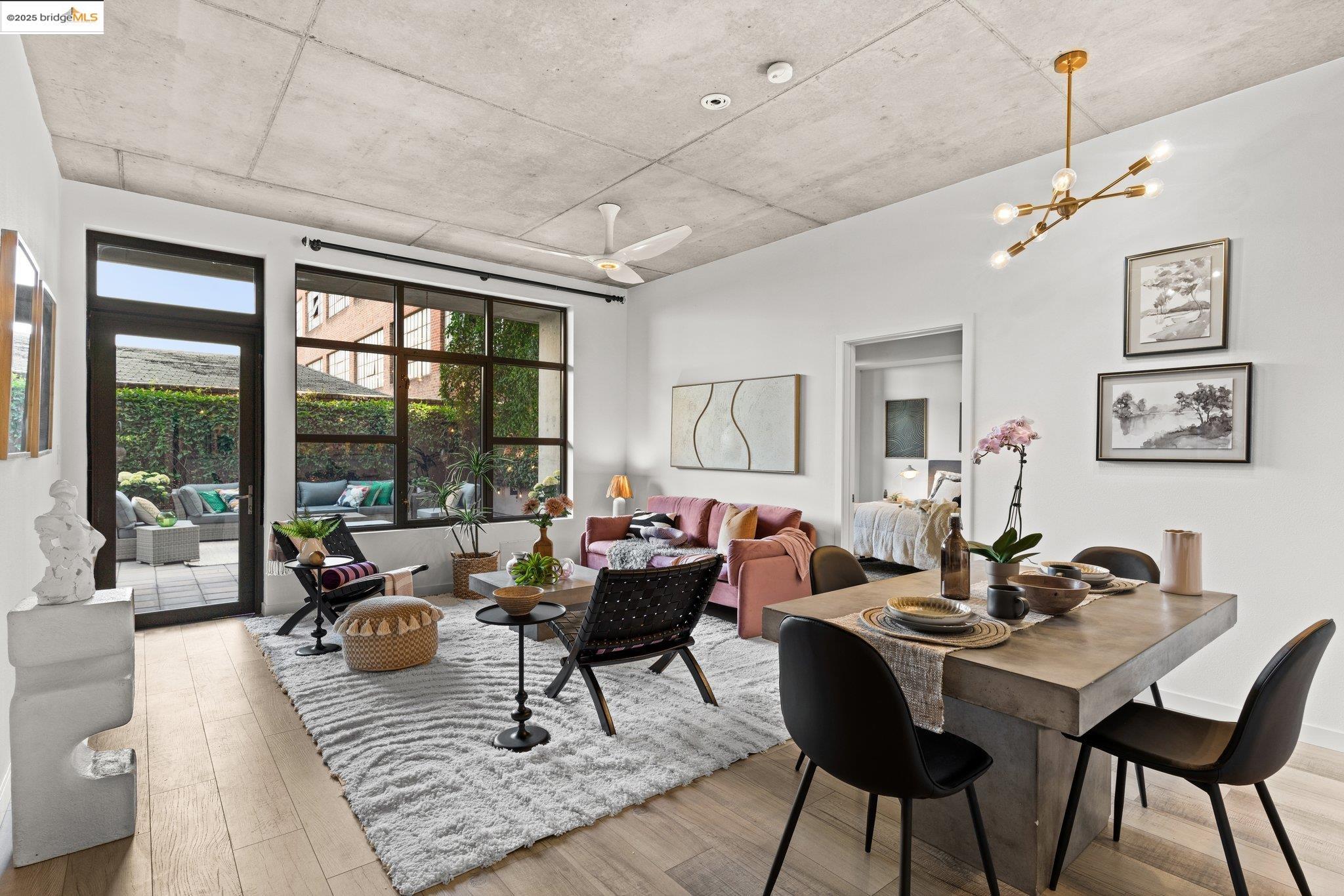288 3rd Street, Unit 213 Oakland, CA 94607 - Photo 1 of 1 a living room with furniture or outdoor view and a large window
