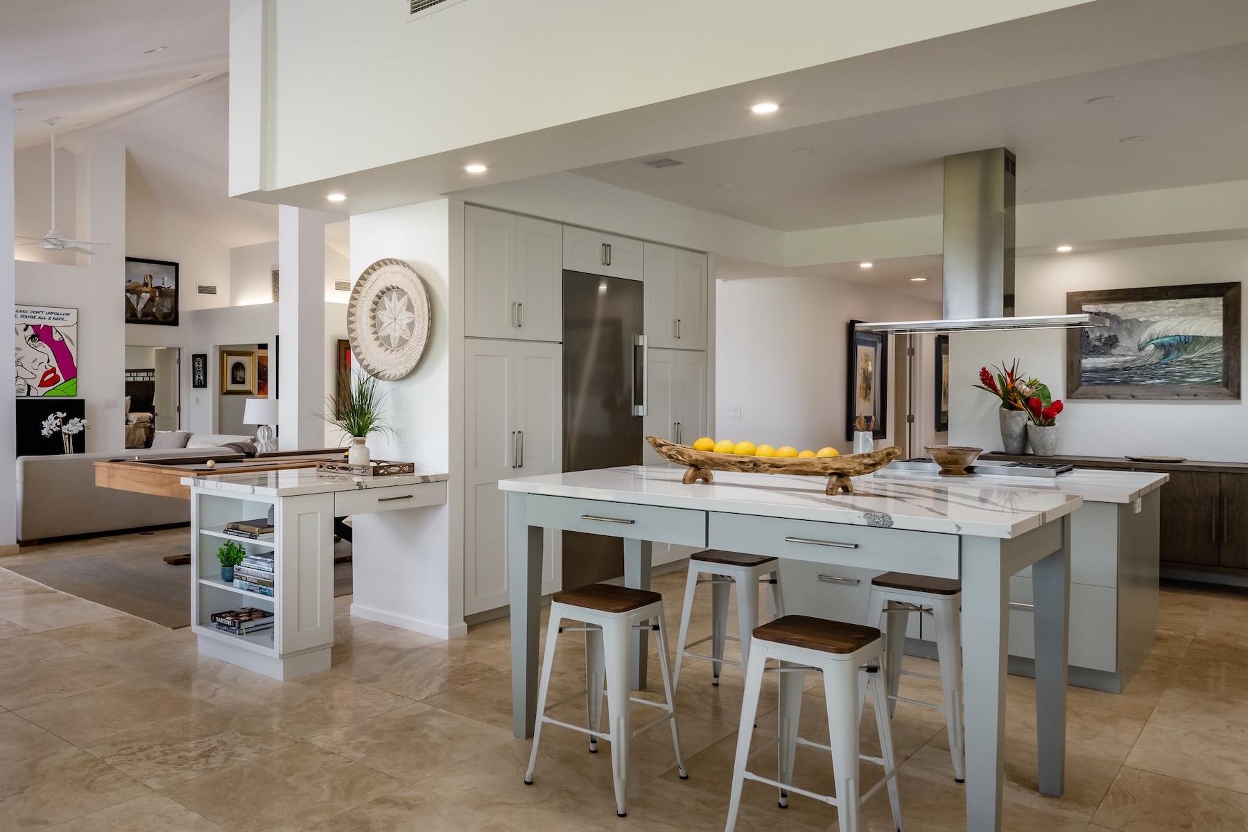 110 Mehana Road Haiku, HI 96708 - Photo 11 of 30 a kitchen with a table and chairs in it