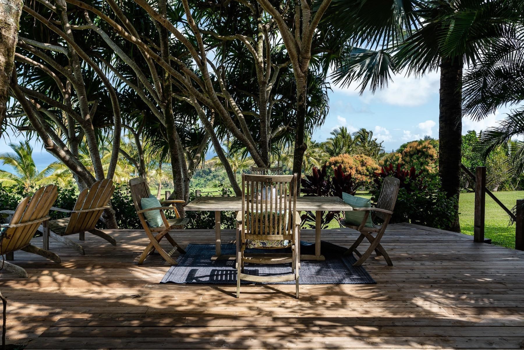 110 Mehana Road Haiku, HI 96708 - Photo 13 of 30 a view of outdoor space with seating area and trees