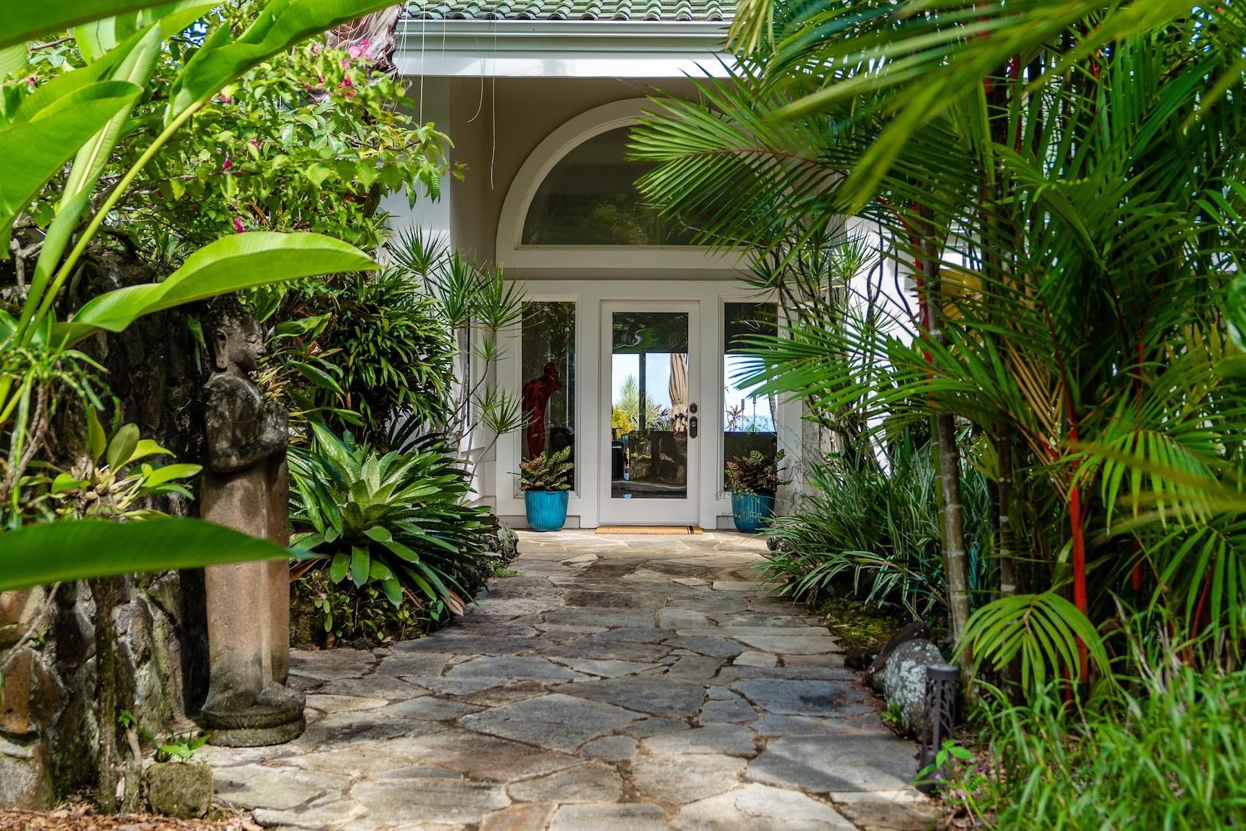 110 Mehana Road Haiku, HI 96708 - Photo 16 of 30 a front view of a house with a garden