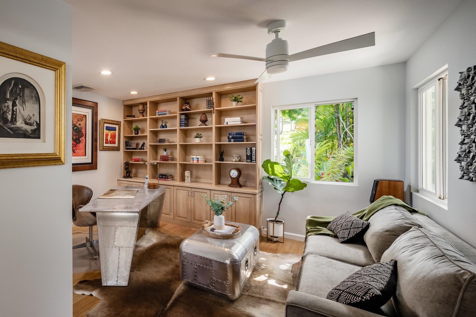 110 Mehana Road Haiku, HI 96708 - Photo 17 of 30 a living room with furniture and a large window