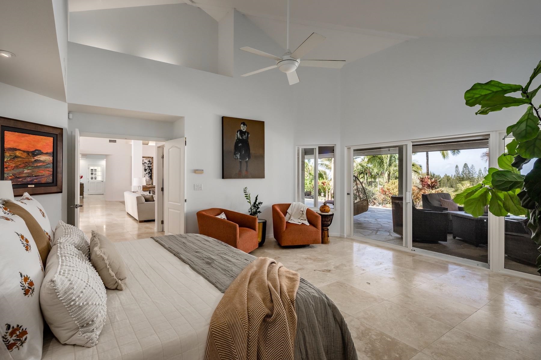 110 Mehana Road Haiku, HI 96708 - Photo 19 of 30 a bedroom with furniture and a large window